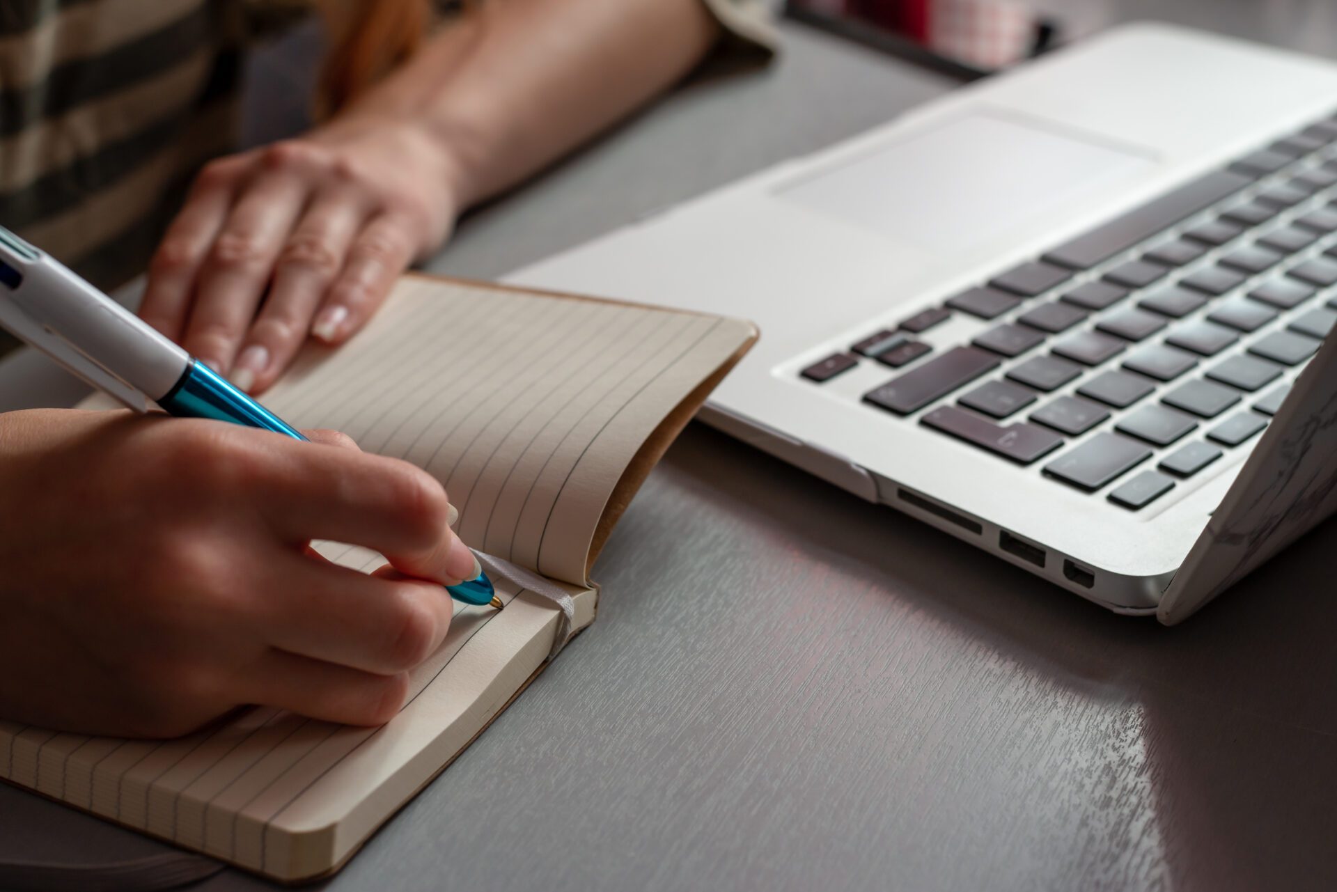 Young woman working at home, Student girl writing in note pad &
